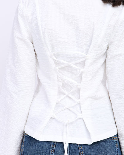 White fitted shirt styled with trousers