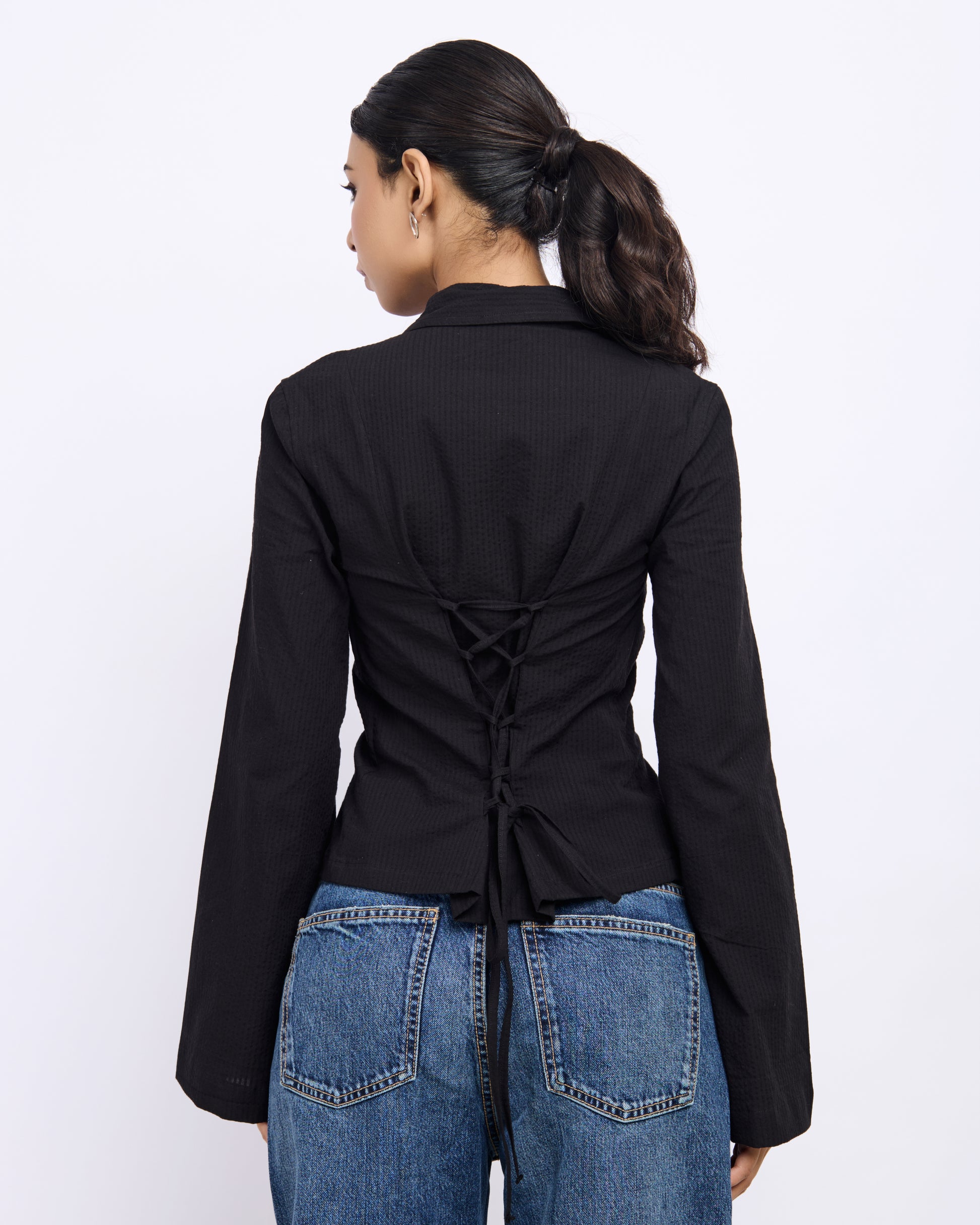 Women’s tailored black shirt with tie-back detail
